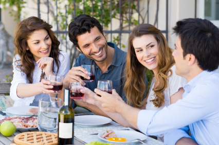 Group Of Happy Young Friends Toasting Wine Glass Outdoor While Having Lunch